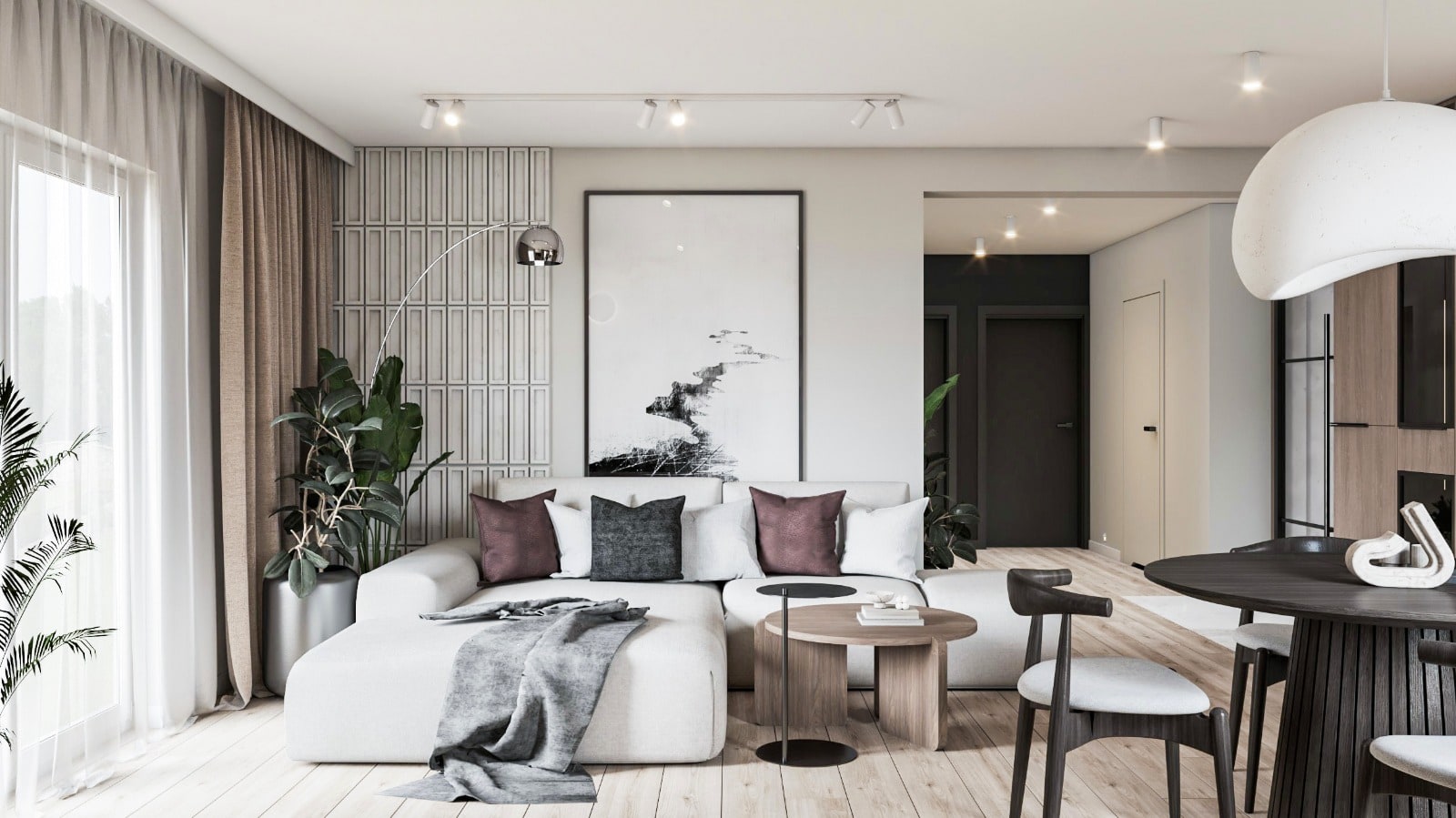 Poglądowy widok salonu z modelu: sofa modułowa, grafika na ścianie ryflowanej, okrągły stół jadalny.